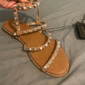 Brown strapped sandals with studs. Never worn.